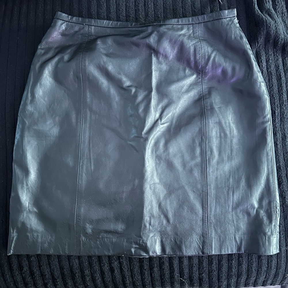 Super cute black 100% sheep leather mini skirt, size 10 gently used.